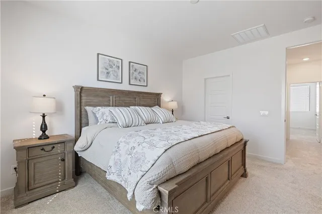 a view of walk in closet with clothes
