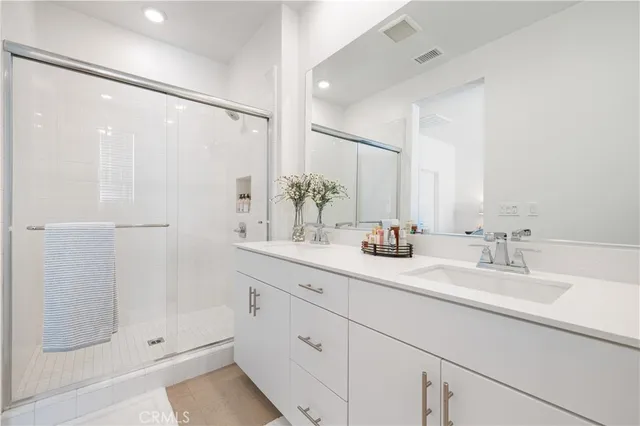 a bedroom with a bed and a cabinets