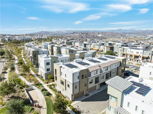 a view of a patio with couches and potted plants