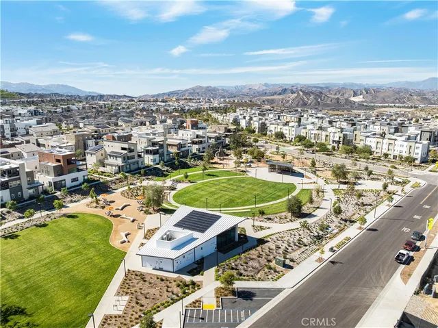 a view of a swimming pool with a patio and a yard