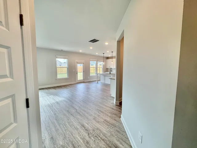 a view of livingroom and hardwood floor