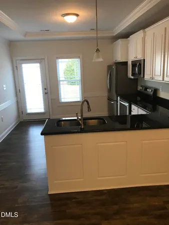 a view of a kitchen with cabinets