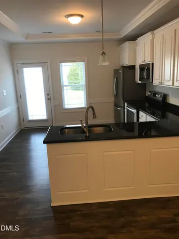 a view of a kitchen with cabinets