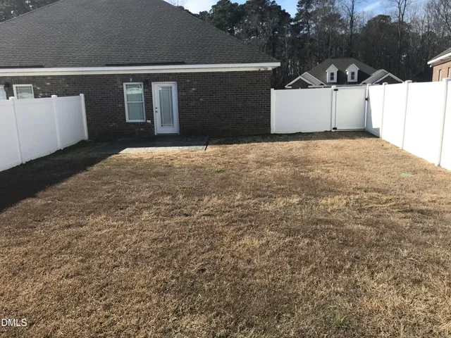 a view of a house with a wall