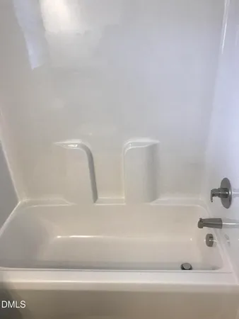 a bathroom with bathtub