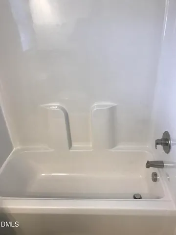 a bathroom with bathtub