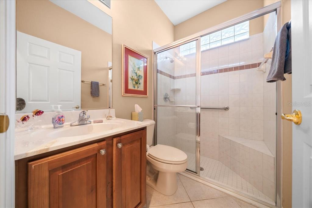 10614 Southwest 71st Terrace Road Ocala, FL 34476 - Photo 17 of 21 a bathroom with a sink toilet and shower