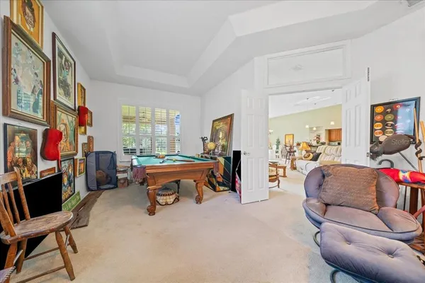 a living room with furniture a couch and a flat screen tv