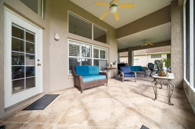 a view of living room with furniture and windows