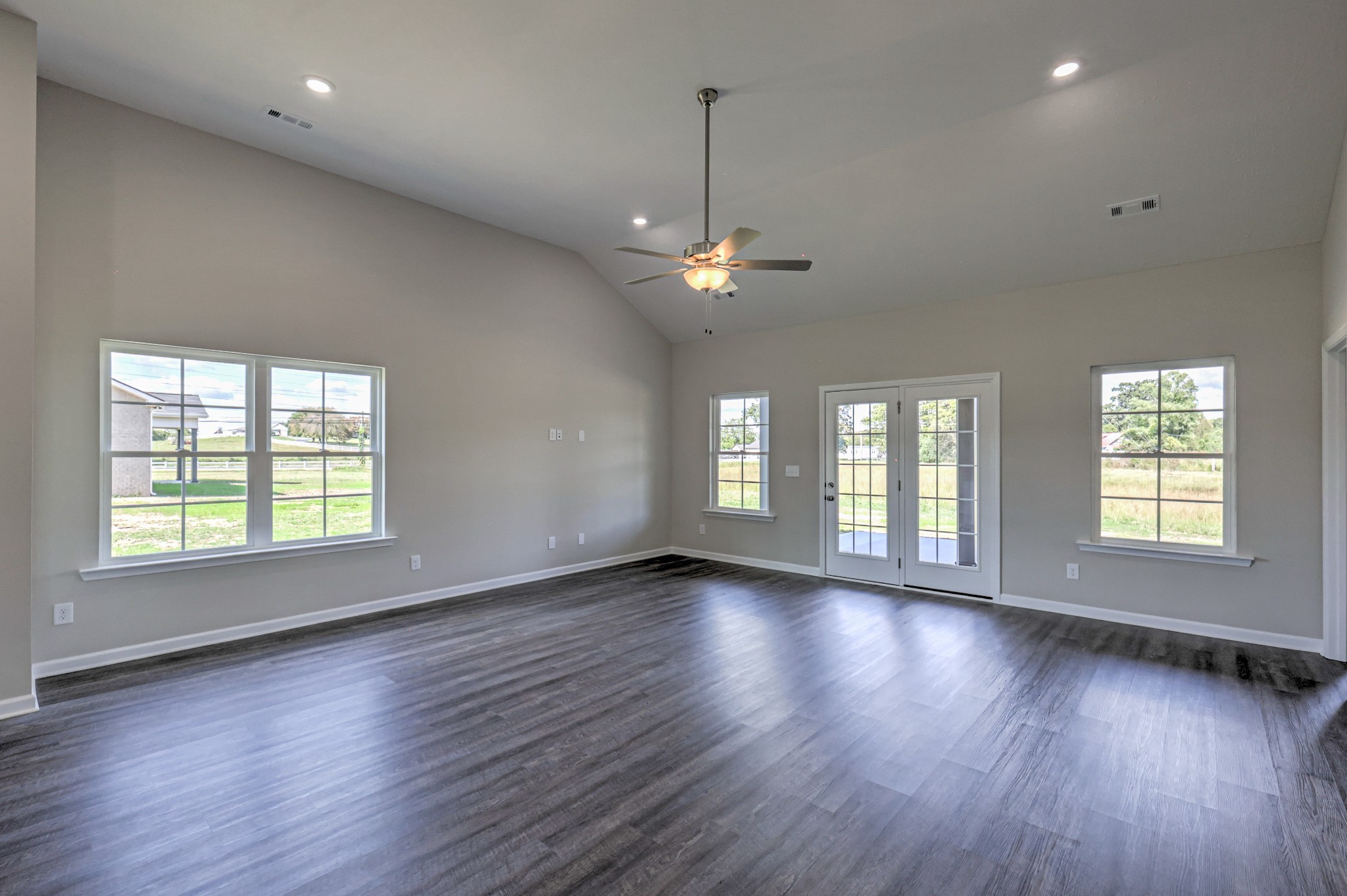 41 Bartow Street Decherd, TN 37324 - Photo 18 of 37 an empty room with wooden floor and windows
