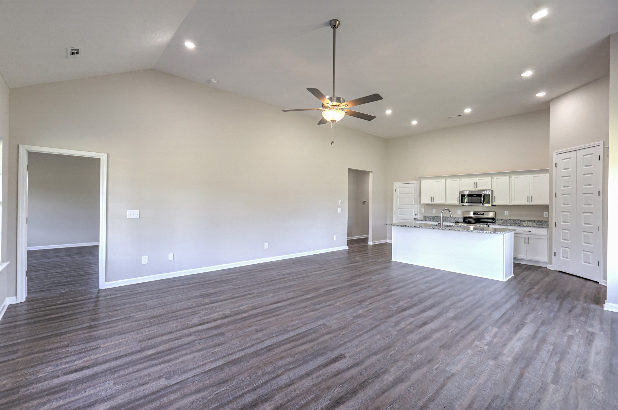 41 Bartow Street Decherd, TN 37324 - Photo 19 of 37 a view of kitchen with granite countertop stainless steel appliances and wooden floor