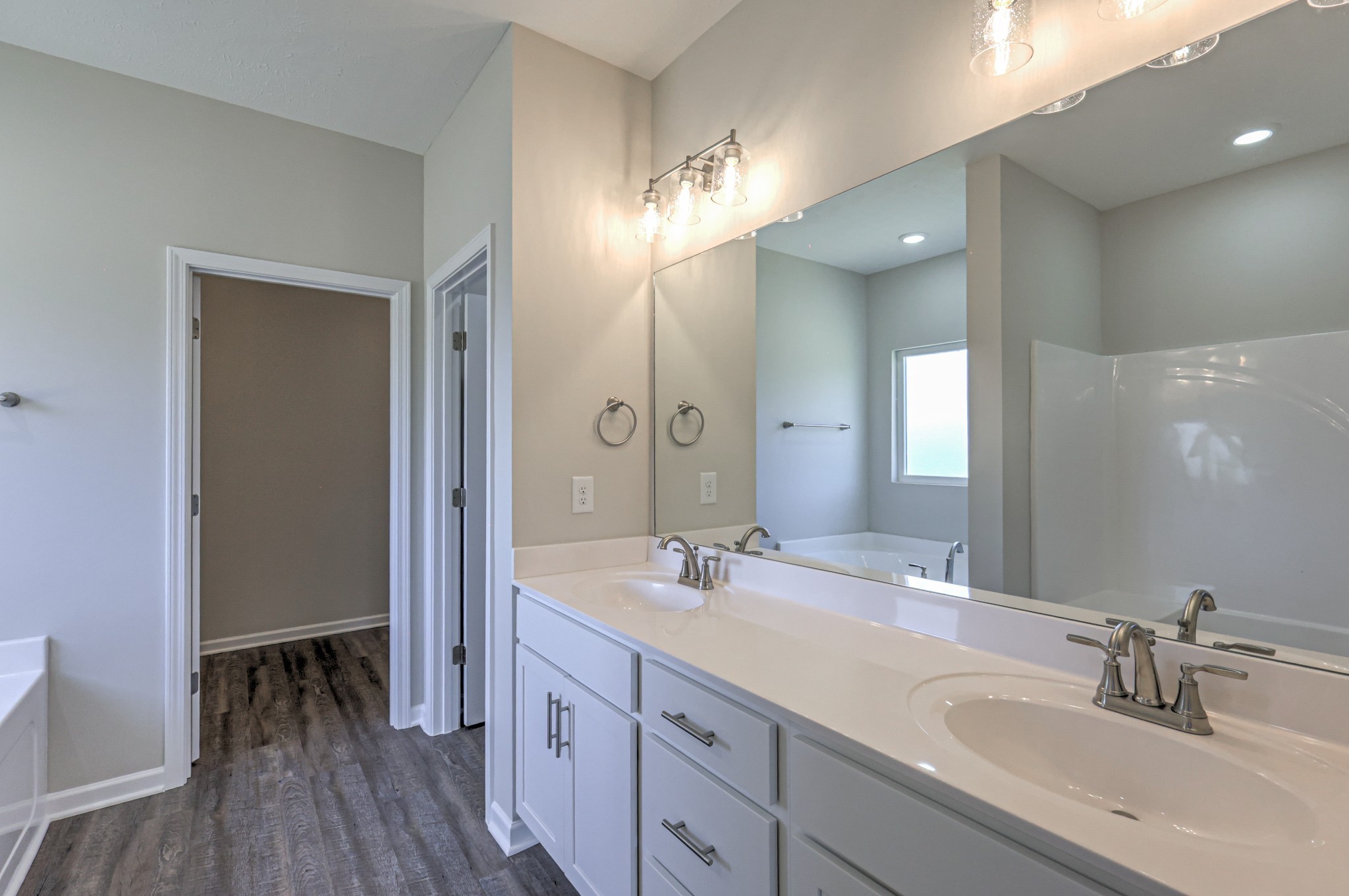 41 Bartow Street Decherd, TN 37324 - Photo 26 of 37 a bathroom with a double vanity sink and a mirror