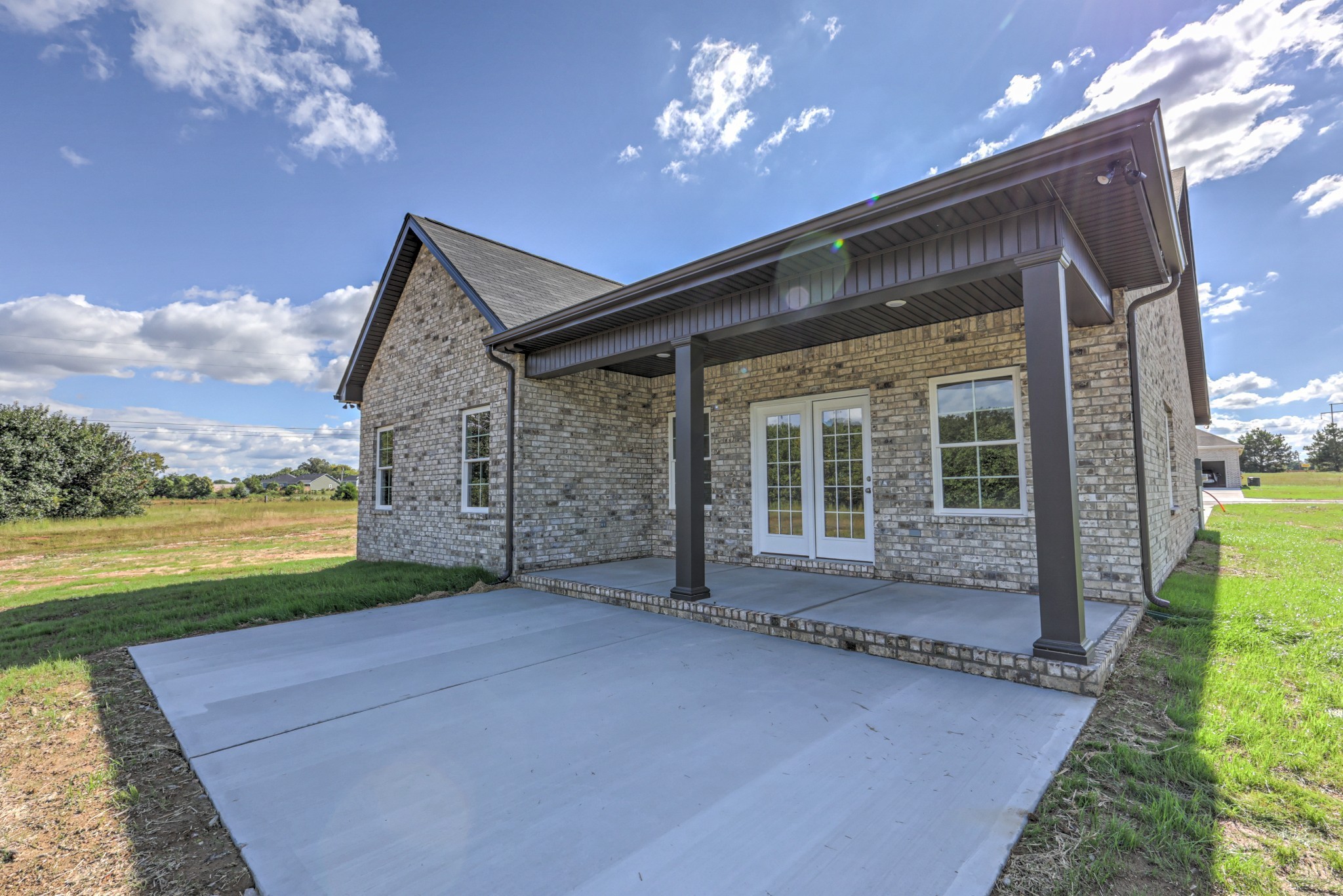 41 Bartow Street Decherd, TN 37324 - Photo 35 of 37 a view of a house with a porch and a yard