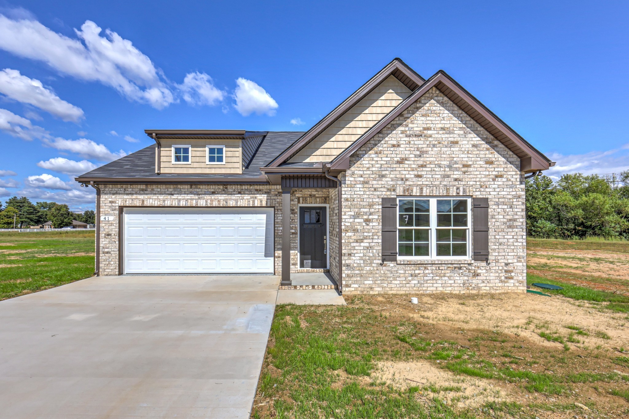 41 Bartow Street Decherd, TN 37324 - Photo 4 of 37 a front view of a house with garden