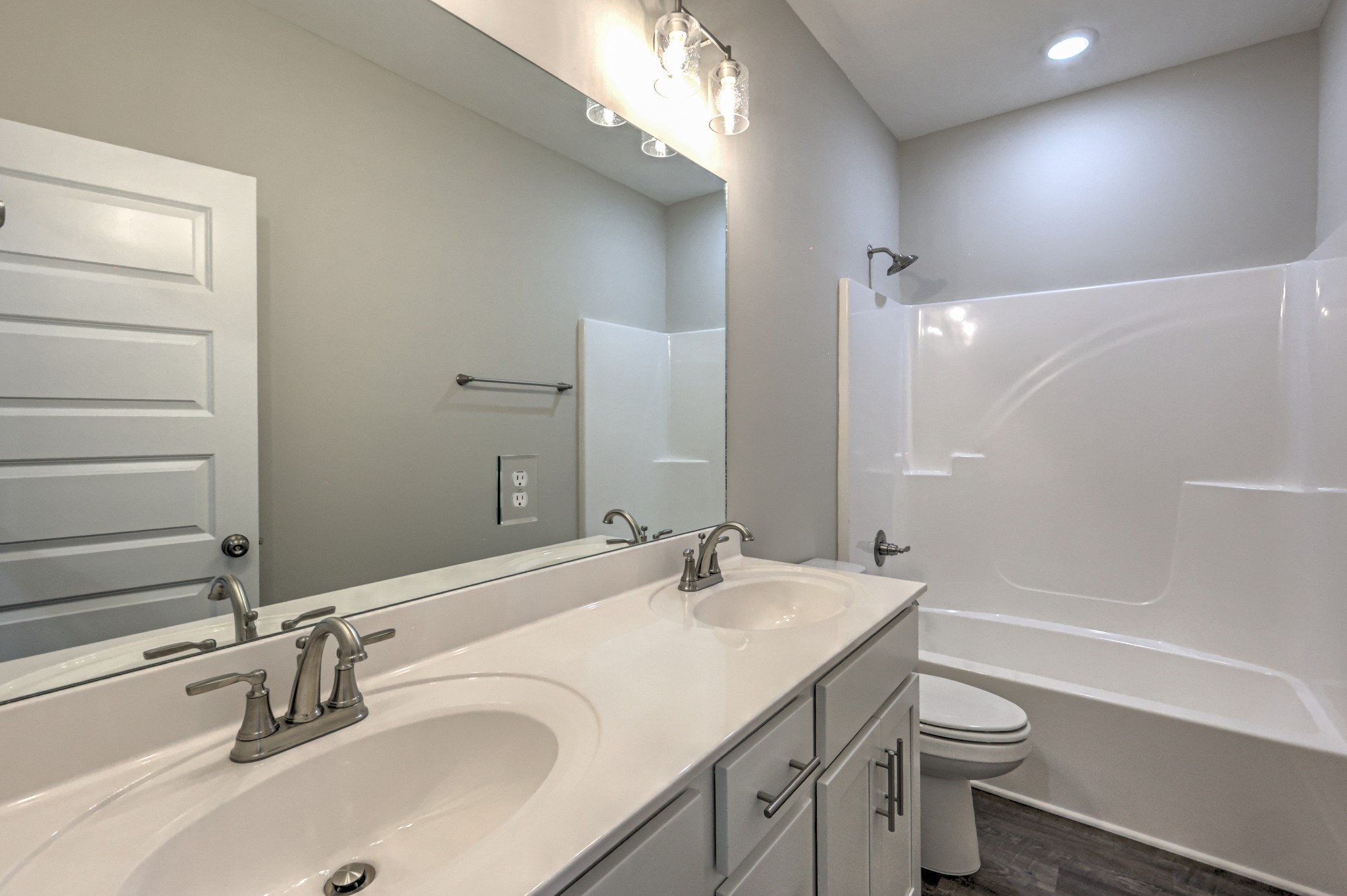 41 Bartow Street Decherd, TN 37324 - Photo 8 of 37 a bathroom with a granite countertop sink a toilet and shower