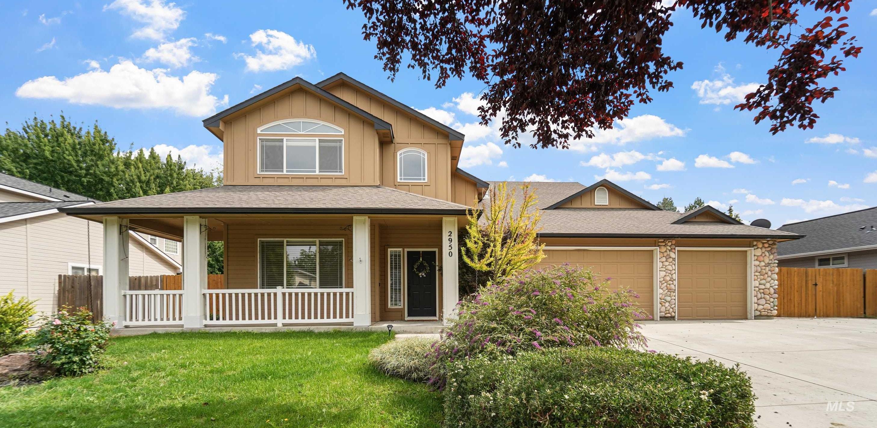 2950 South Givens Way Meridian, ID 83642 - Photo 1 of 1 View of front facade with covered porch, board and batten siding, concrete driveway, a garage, and stone siding