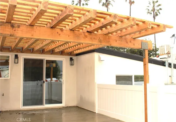 a view of a building with a door and a bed