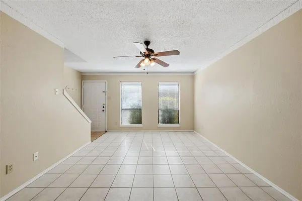 a kitchen with stainless steel appliances a refrigerator and a stove top oven