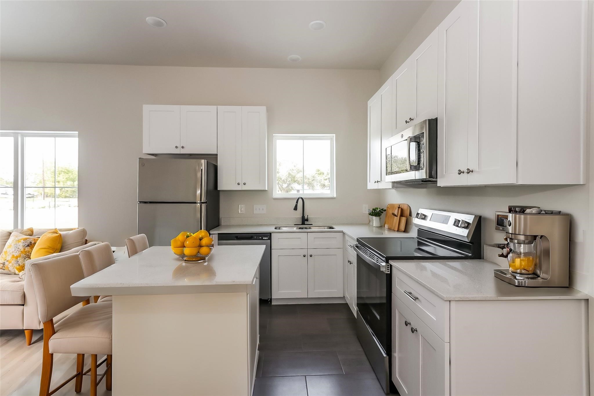 3726 Bellfort Avenue, Unit F3 Houston, TX 77051 - Photo 3 of 13 a kitchen with a sink a stove and cabinets