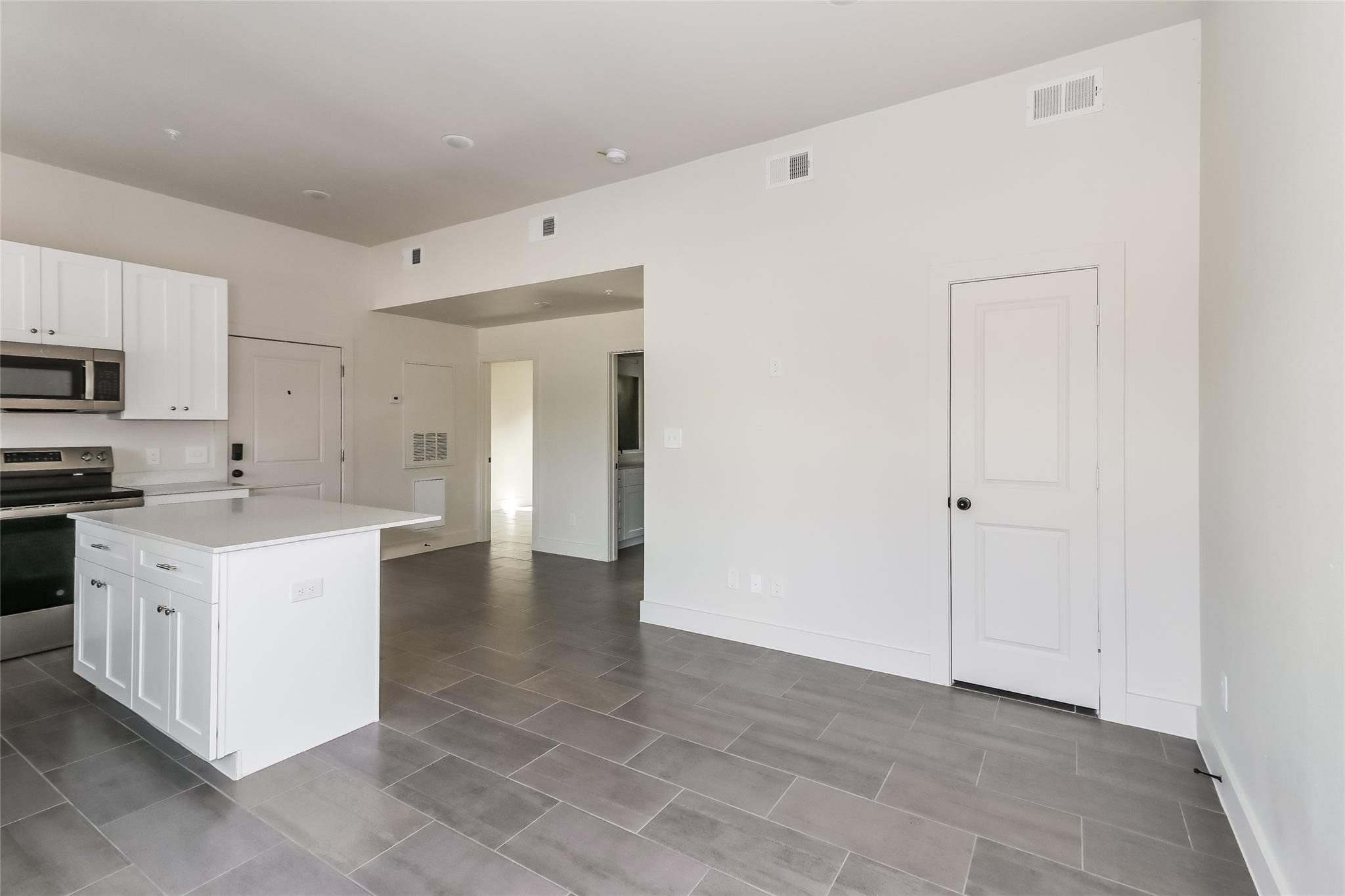 3726 Bellfort Avenue, Unit F3 Houston, TX 77051 - Photo 7 of 13 a view of a kitchen with white cabinets