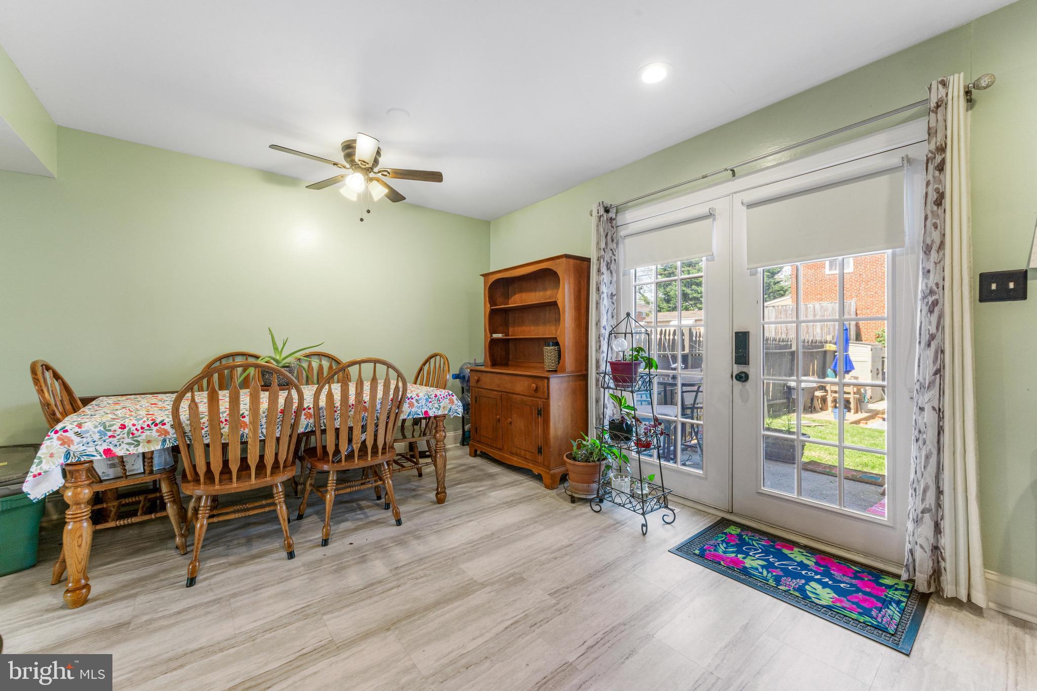 4842 Melbourne Road Baltimore, MD 21229 - Photo 7 of 22 a bedroom with furniture and a chandelier