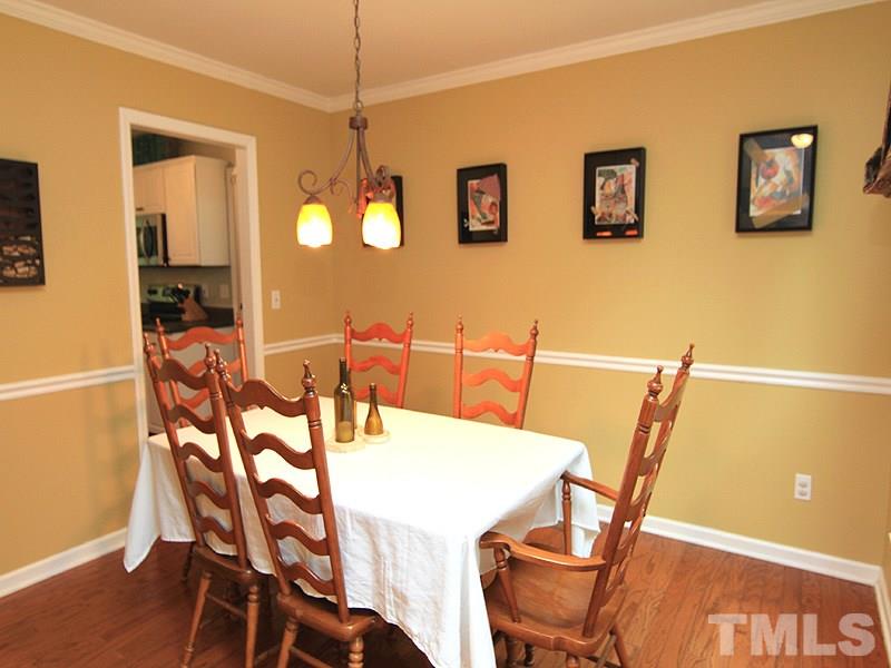 3601 Hopper Street Raleigh, NC 27616 - Photo 2 of 13 a view of a dining room with furniture and wooden floor