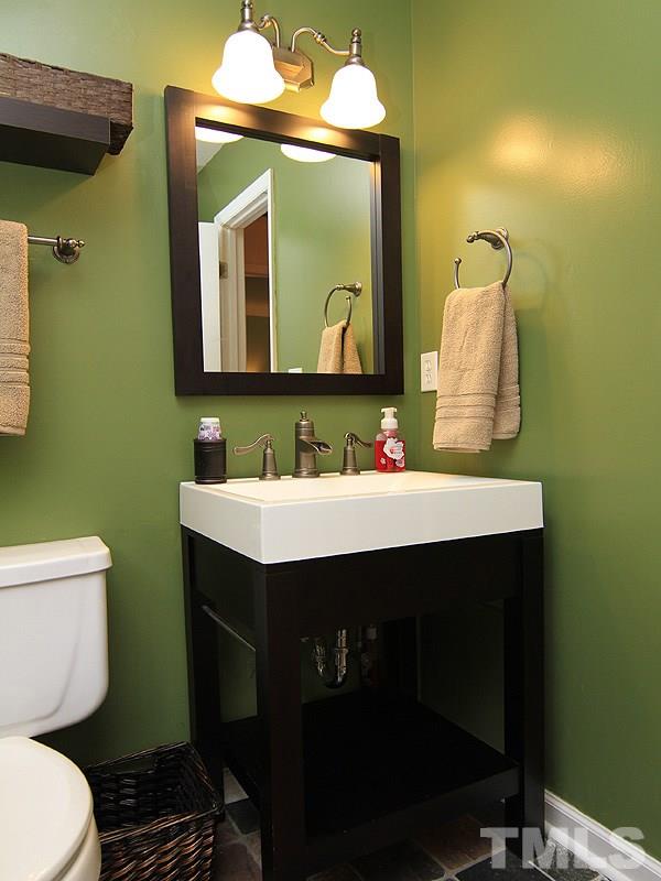 3601 Hopper Street Raleigh, NC 27616 - Photo 11 of 13 a bathroom with a sink mirror vanity and toilet