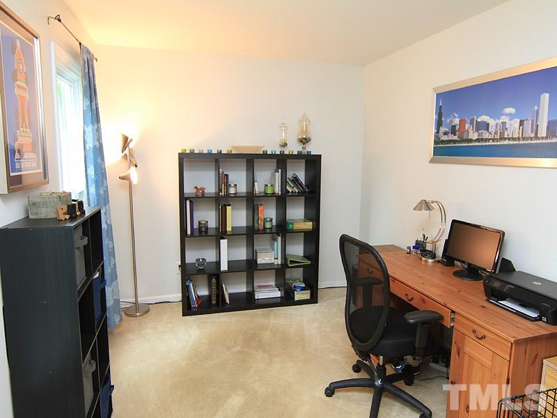3601 Hopper Street Raleigh, NC 27616 - Photo 3 of 13 a view of a workspace with furniture and a window