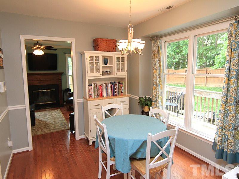 3601 Hopper Street Raleigh, NC 27616 - Photo 5 of 13 a view of a dining room with furniture window and wooden floor