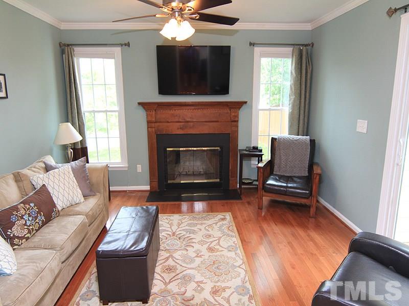 3601 Hopper Street Raleigh, NC 27616 - Photo 6 of 13 a living room with furniture and a fireplace