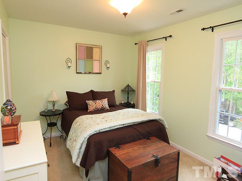 3601 Hopper Street Raleigh, NC 27616 - Photo 9 of 13 a bedroom with a bed and a window