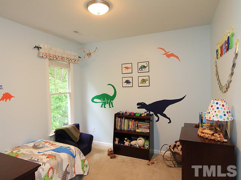 3601 Hopper Street Raleigh, NC 27616 - Photo 10 of 13 a bedroom with bed and a window