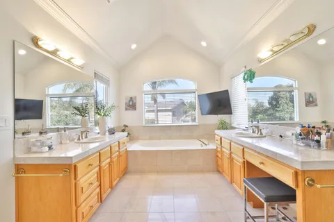 a large spacious bathroom with a large tub and sink