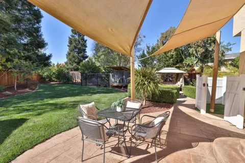 a view of a patio with a yard