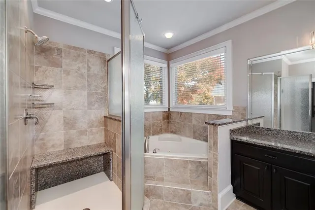 a view of staircase with two couches and a large window with wooden floor