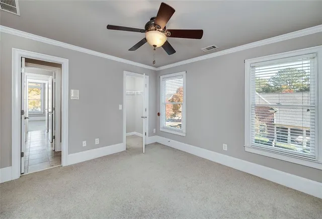 a room with furniture pool table and wooden floor