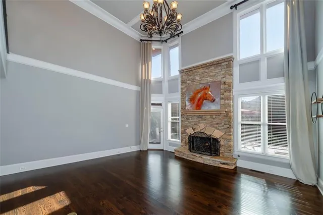 a kitchen with granite countertop a refrigerator stove and sink