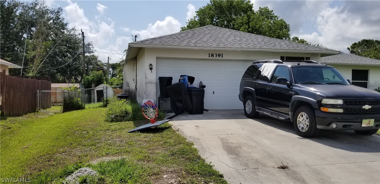 18391 Hawthorne Road Fort Myers, FL 33967 - Photo 7 of 7 a view of a car parked in front of a house
