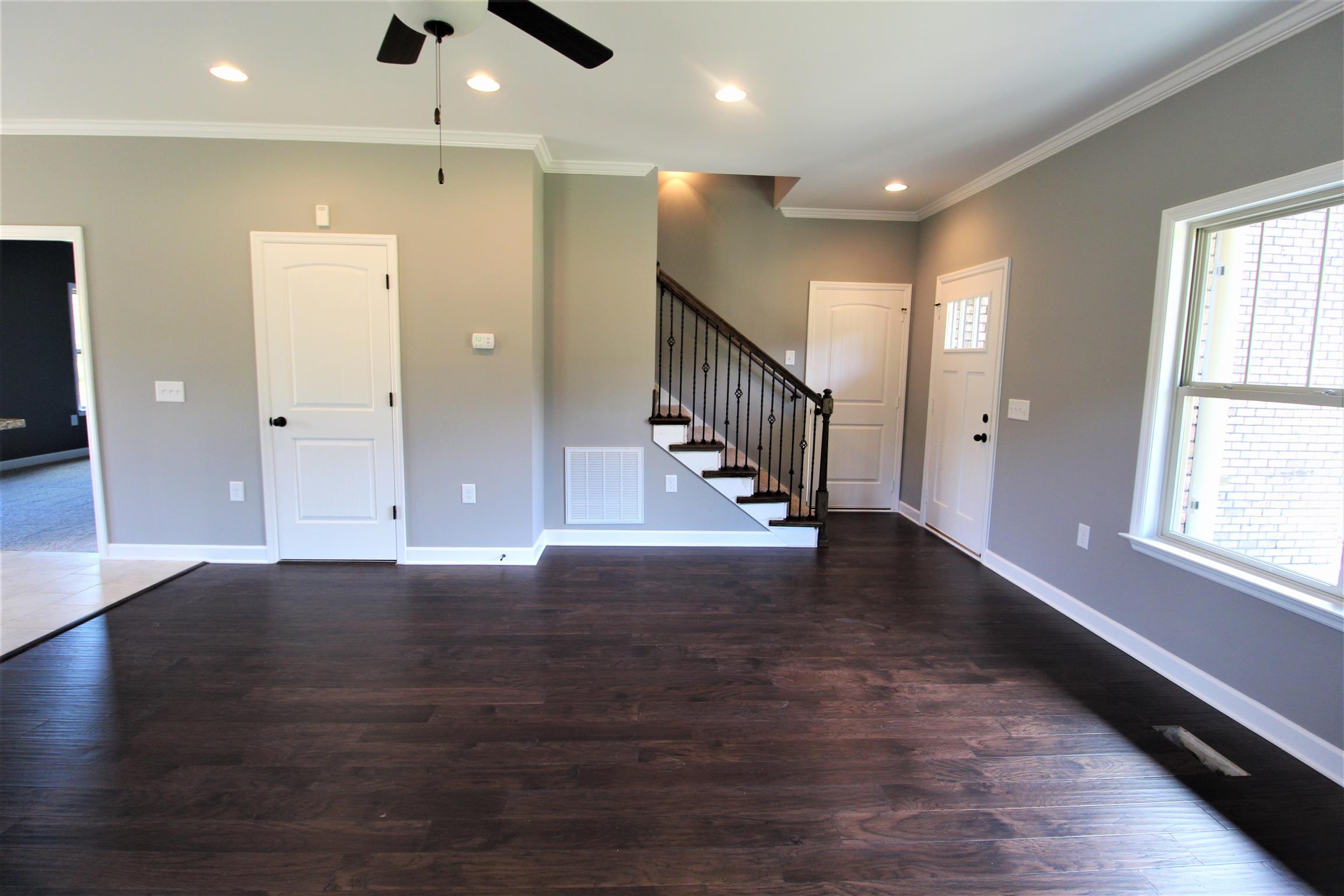 855 Quarry Road Mount Juliet, TN 37122 - Photo 5 of 27 an empty room with wooden floor and windows