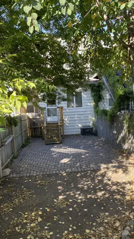 a view of a backyard with sitting area