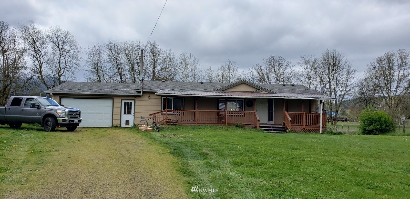 2455 Wildwood Road Curtis, WA 98538 - Photo 2 of 2 a view of a house with a yard and sitting area