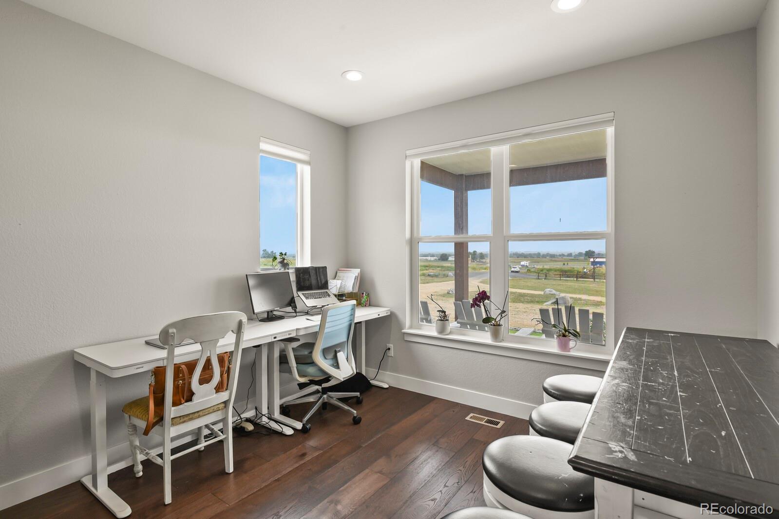11617 Harpenden Court Fort Lupton, CO 80621 - Photo 15 of 50 a workspace with furniture and a large window