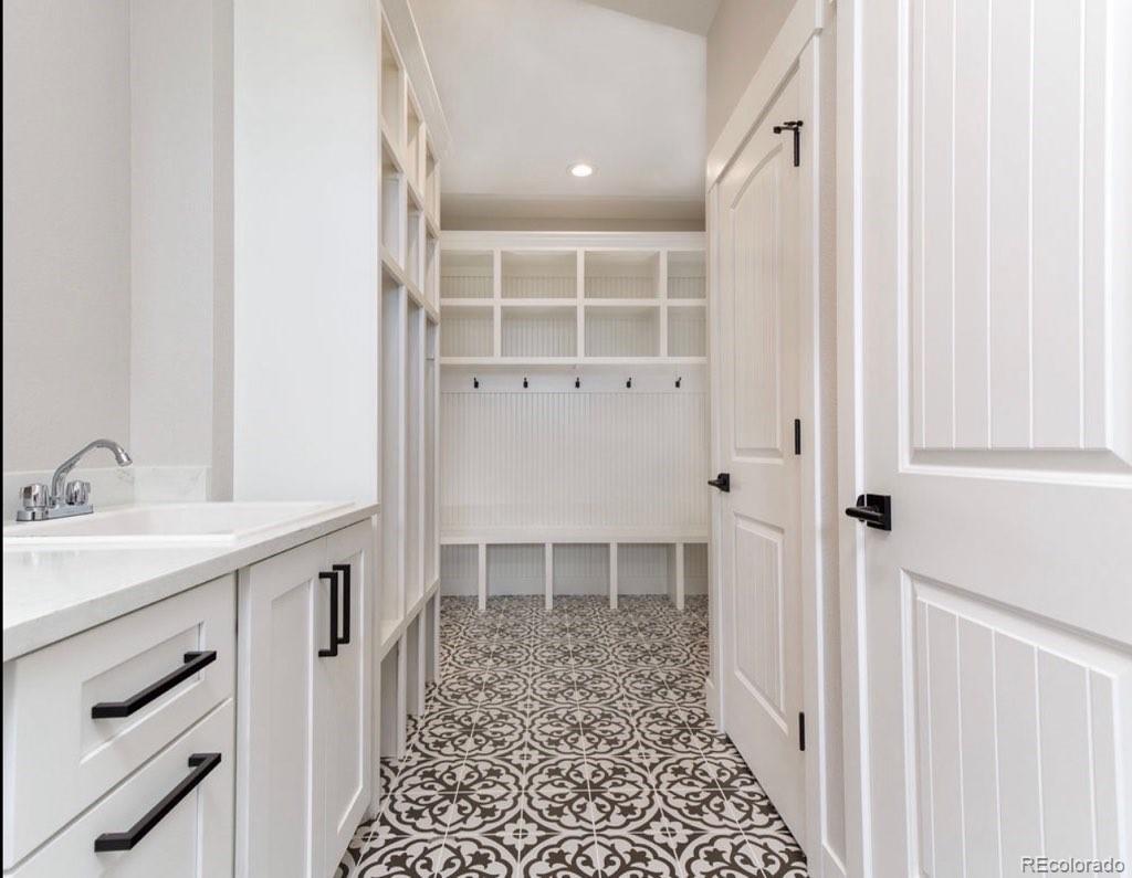 11617 Harpenden Court Fort Lupton, CO 80621 - Photo 17 of 50 a bathroom with a sink and a mirror