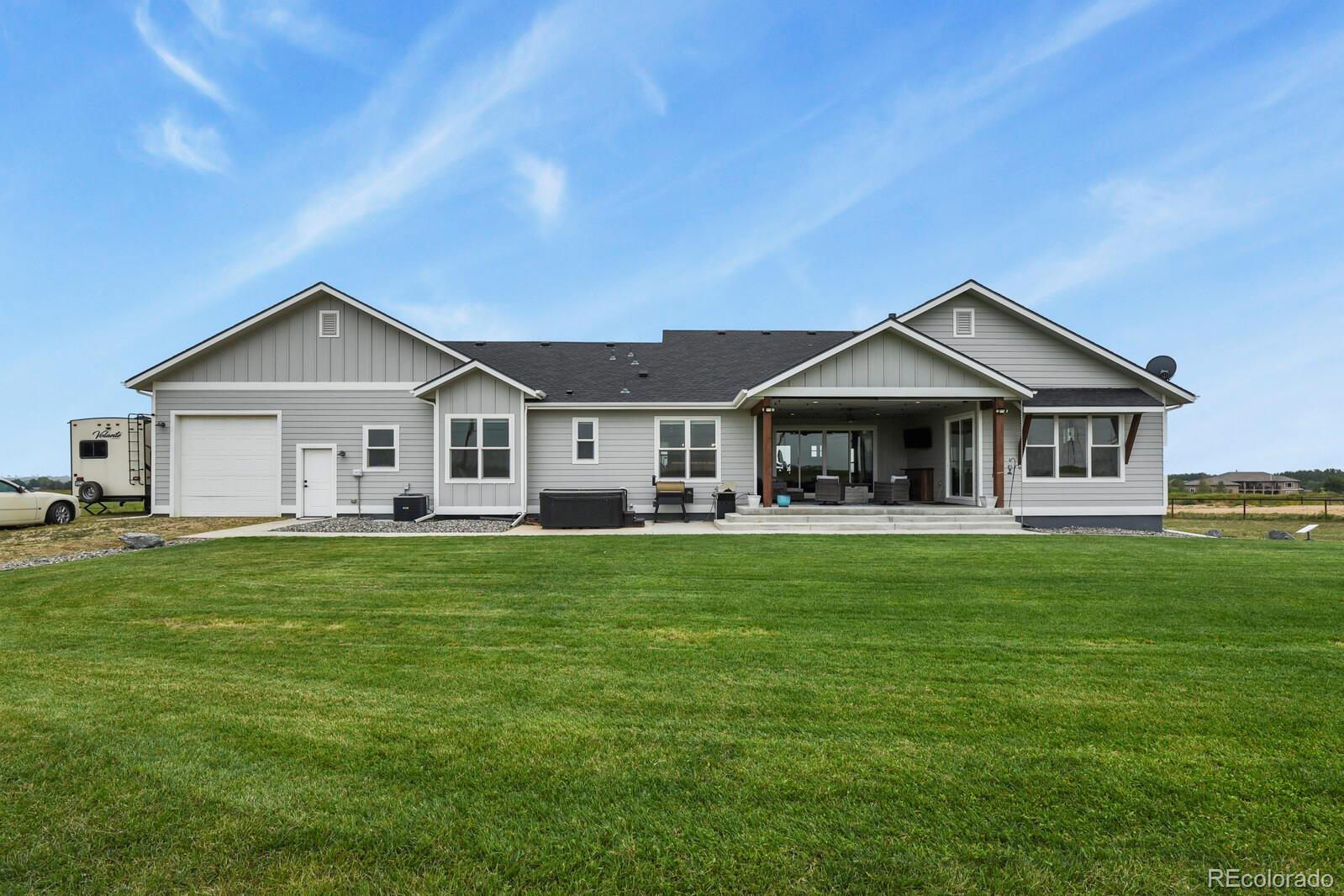11617 Harpenden Court Fort Lupton, CO 80621 - Photo 2 of 50 a front view of a house with a garden