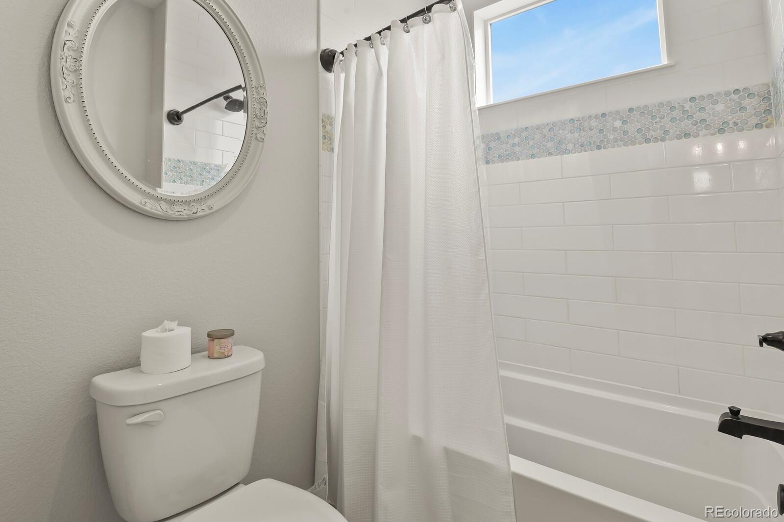 11617 Harpenden Court Fort Lupton, CO 80621 - Photo 28 of 50 a bathroom with a toilet and a vanity