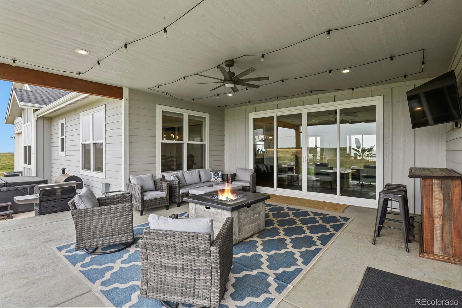 11617 Harpenden Court Fort Lupton, CO 80621 - Photo 35 of 50 a living room with furniture and a large window