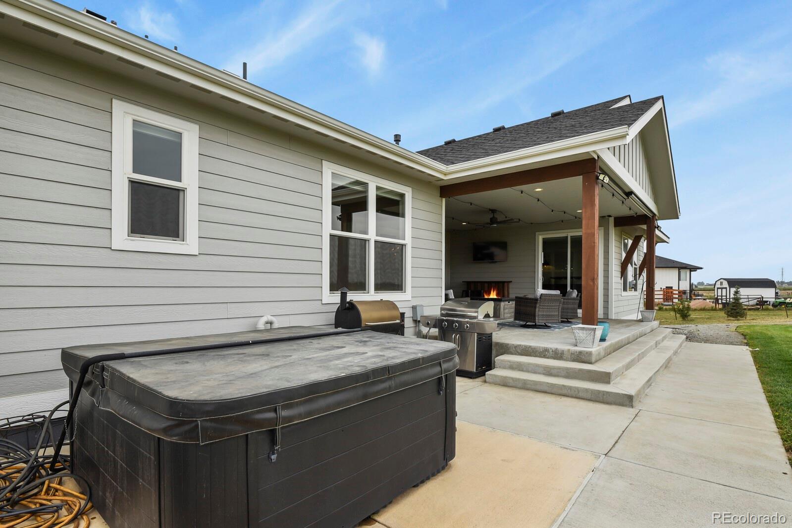 11617 Harpenden Court Fort Lupton, CO 80621 - Photo 36 of 50 a view of house with outdoor kitchen