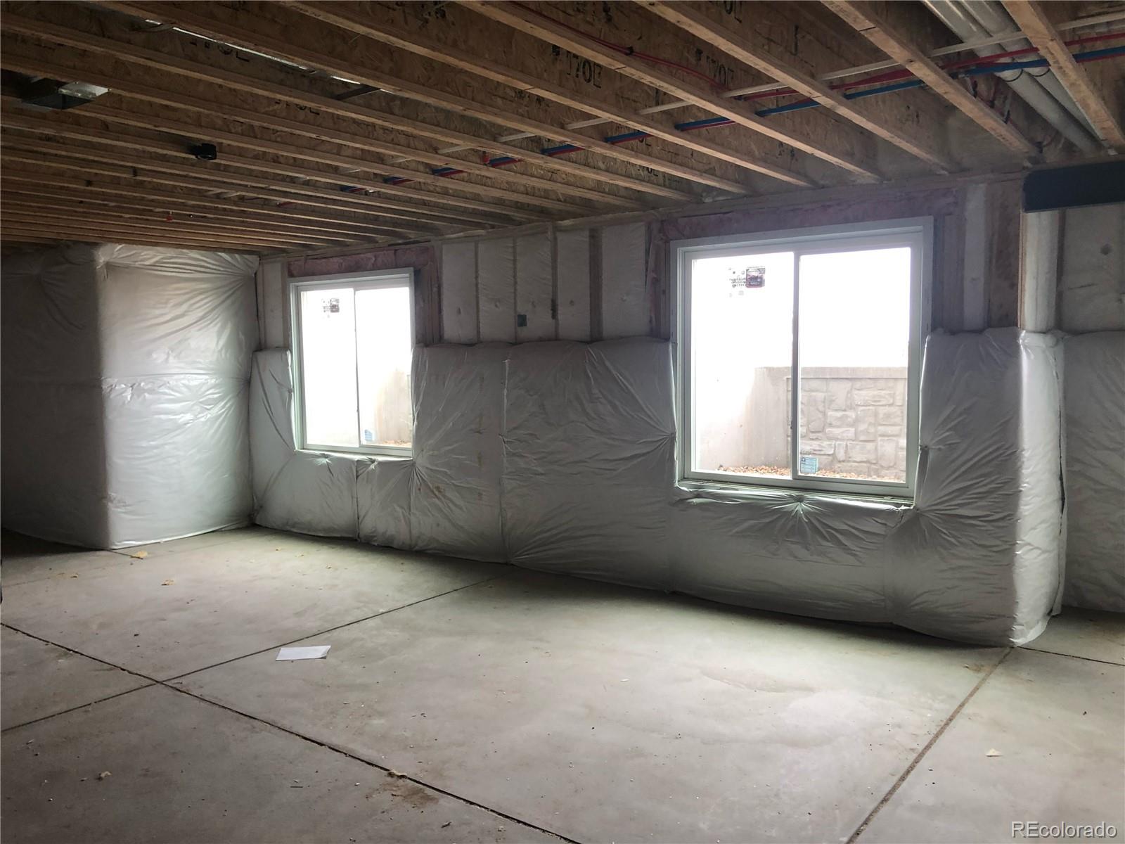 11617 Harpenden Court Fort Lupton, CO 80621 - Photo 40 of 50 an empty room with windows