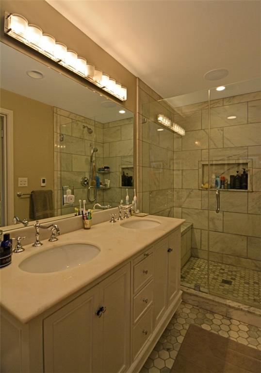 3 Edgewood Road Pittsburgh, PA 15215 - Photo 12 of 18 The upgraded master bath provides a dual-sink vanity and an oversized glass-door shower.