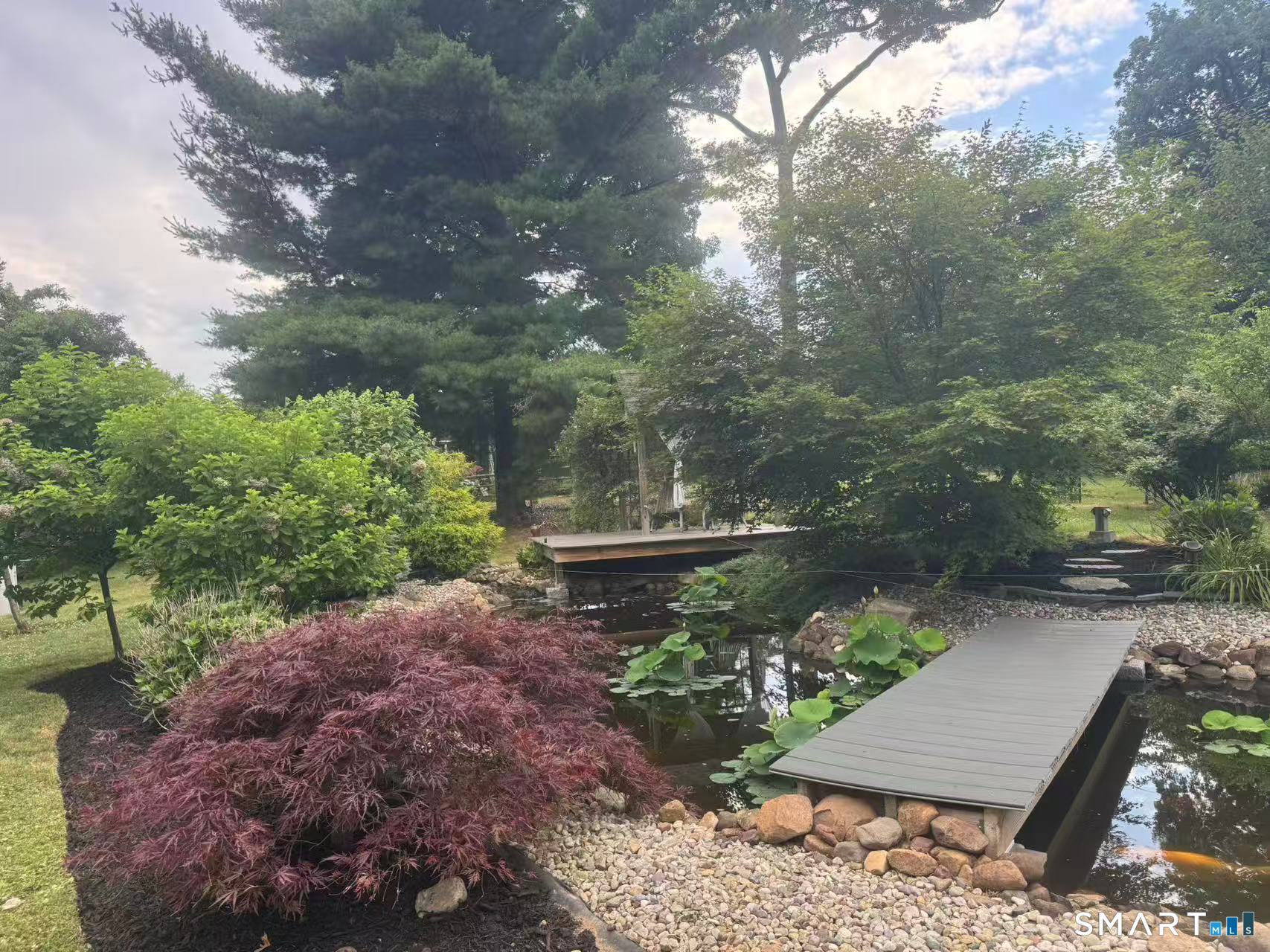 1122 Fienemann Road Farmington, CT 06032 - Photo 23 of 26 a view of a pathway with a yard